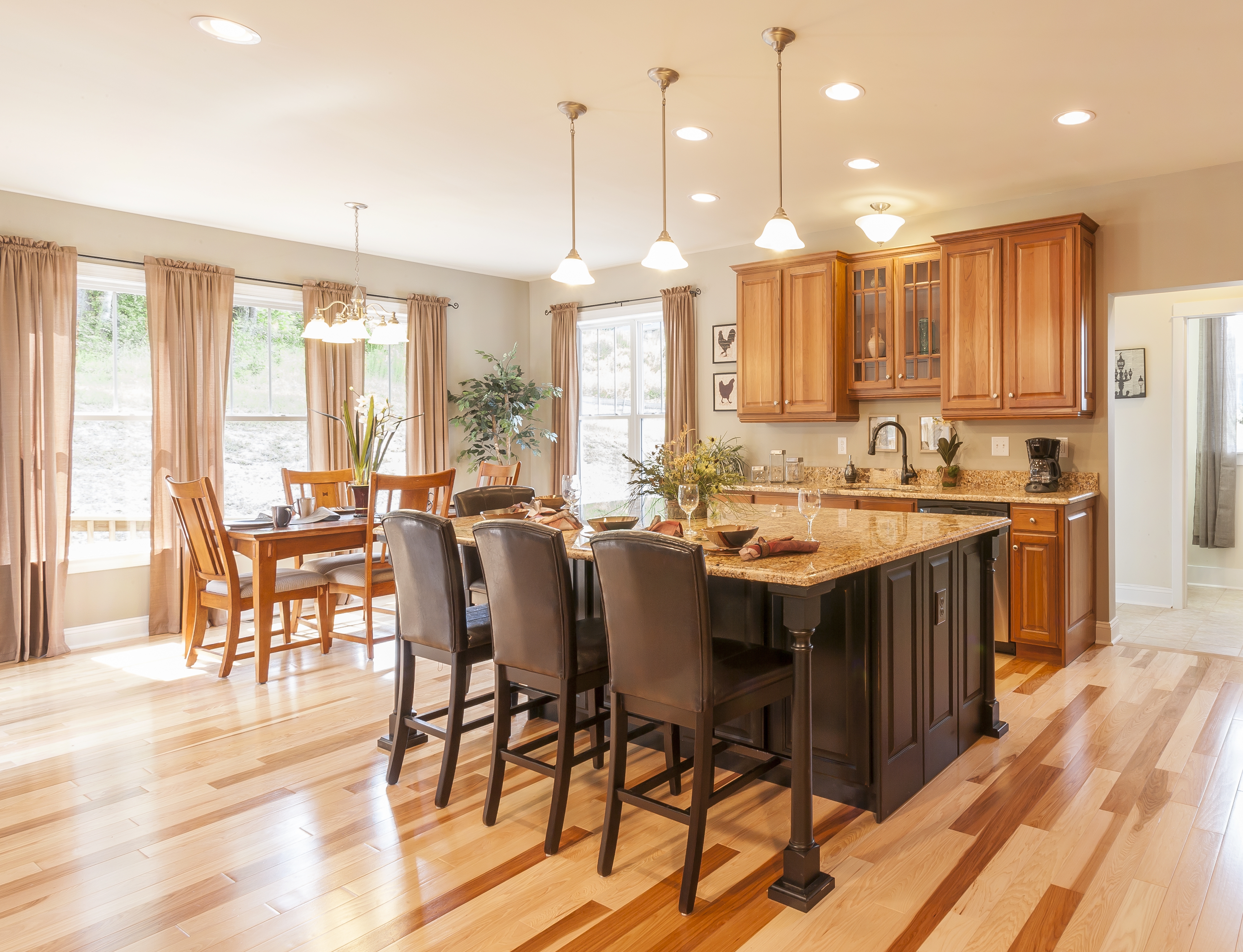 kitchen with wood cabinetry and flooring